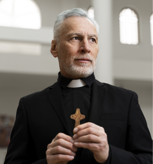 priest holding blessify comfort pocket cross